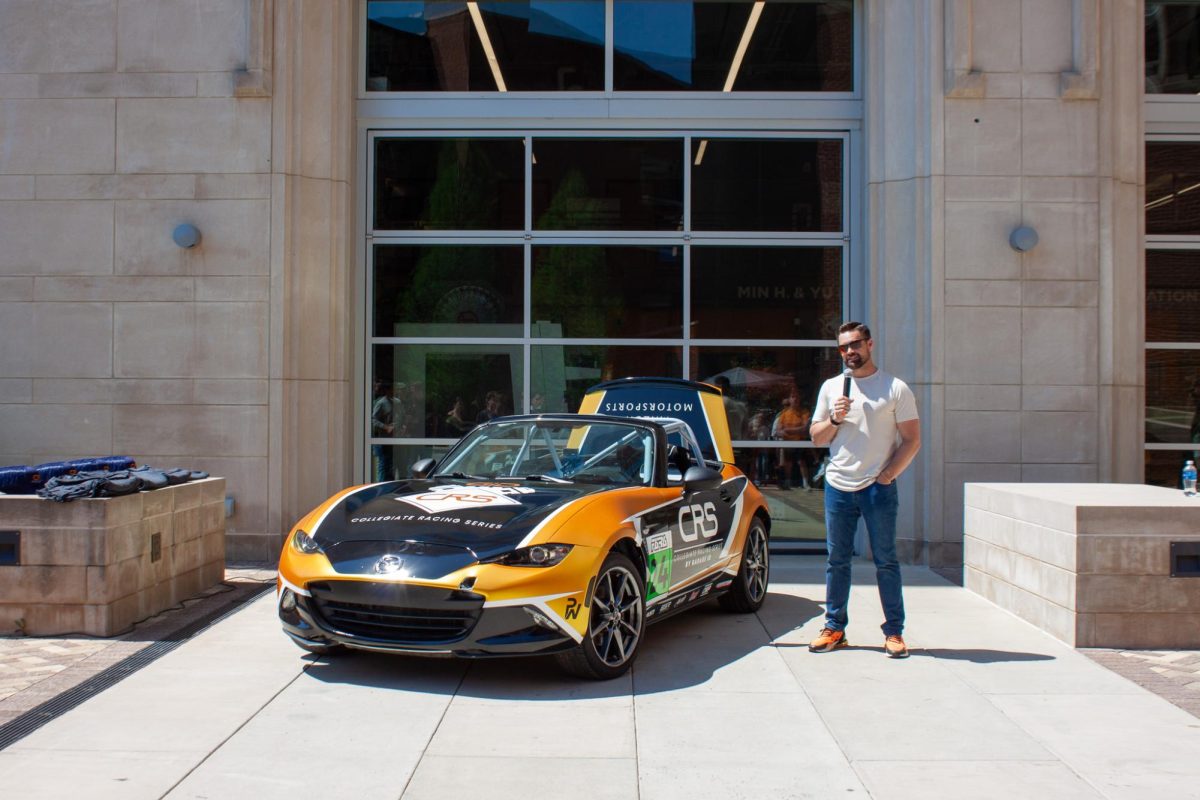 Ricky Stenhouse Jr. next to the 2026 Collegiate Racing Series car.