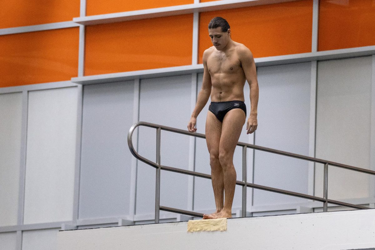 Nick Stone prepares to dive during the finals of the Tennessee Diving Invitational at the Allan Jones Intercollegiate Aquatic Center. Friday, Jan.9, 2026.