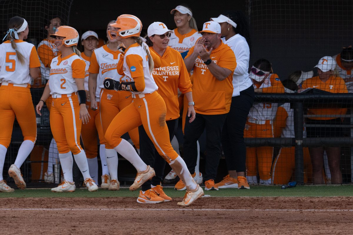 Elsa Morrison (22) high sives coach Karen Weekly after hitting a home run against Northern Kentucky during the NCAA Regionals at Sherri Parker Lee Stadium. Friday, May 15, 2026.
