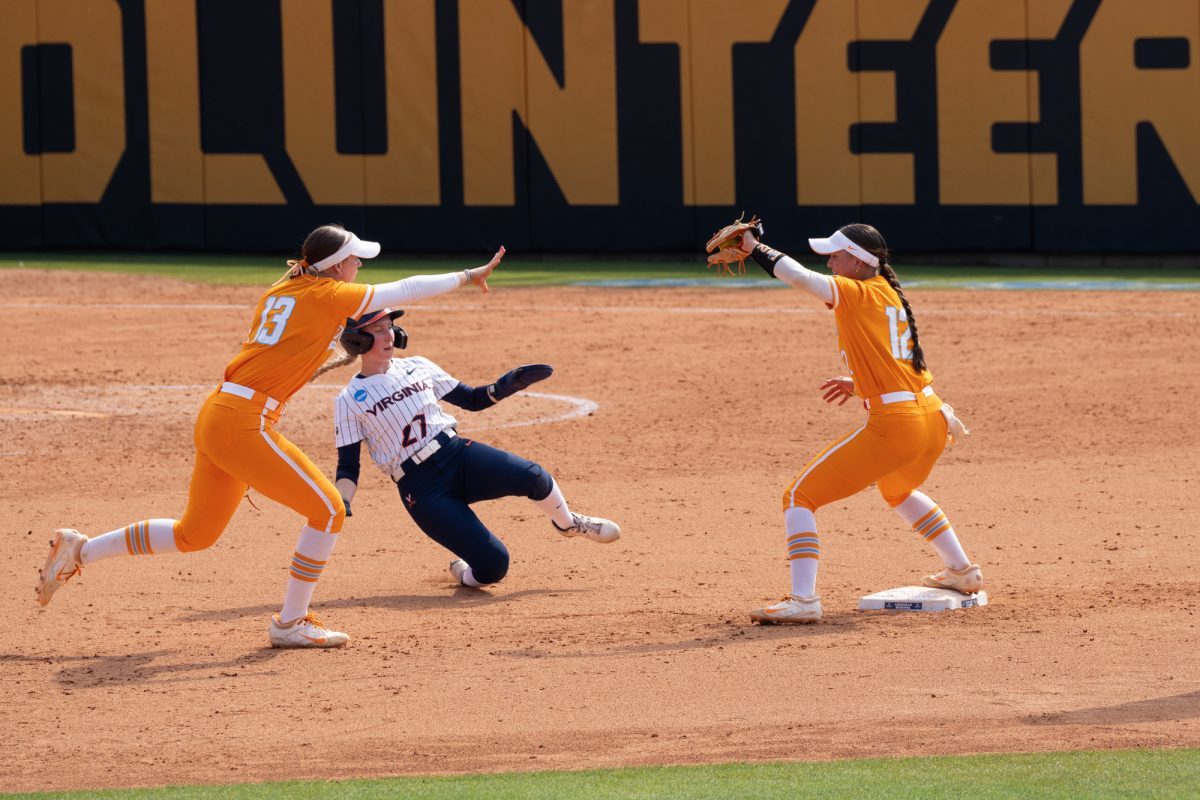 Emma Clarke (13) flips the ball to Bella Faw (12) for the final out against Virginia in the NCAA Regionals at Sherri Parker Lee Stadium to send Tennessee to the Super Regionals. Sunday, May 17, 2026.