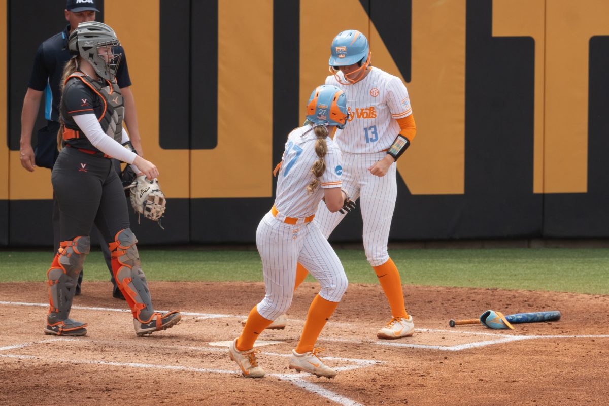 Taelyn Holley (27) draws a bases loaded walk to score Emma Clarke as the Lady Vols take on Virginia in the NCAA Regionals at SHerri Parker Lee Stadium. Saturday, May 16, 2026.
