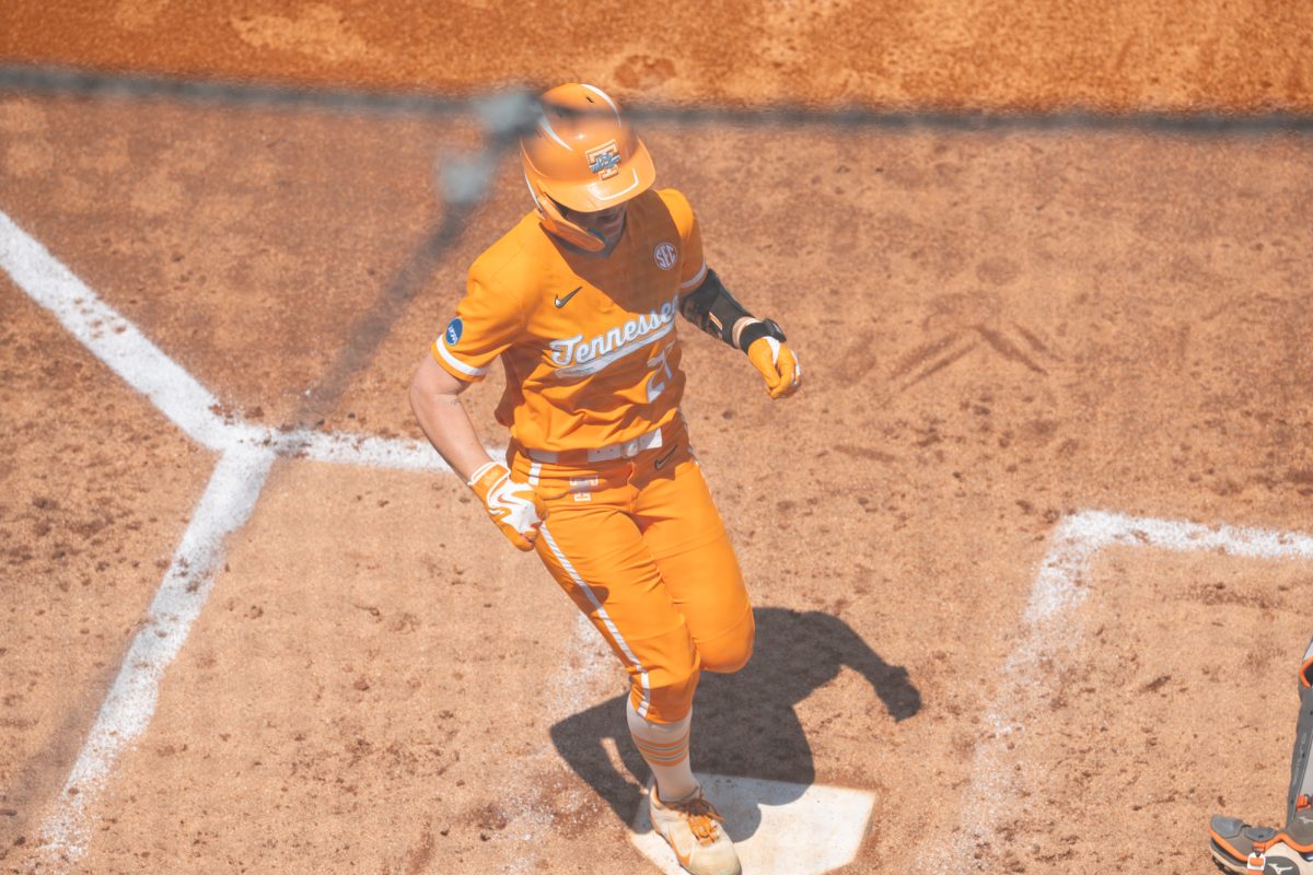 Taelyn Holley (27) beats the throw home and scores against Virginia in the NCAA Regionals at Sherri Parker Lee Stadium. Sunday, May 17, 2026.