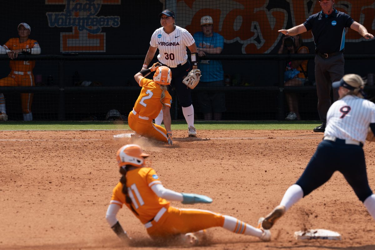Sophia Knight (2) slides into third as Zoie Shuler (11) is forced out at second by Virginia in the NCAA Regionals at Sherri Parker Lee Stadium. Sunday, May 17, 2026.