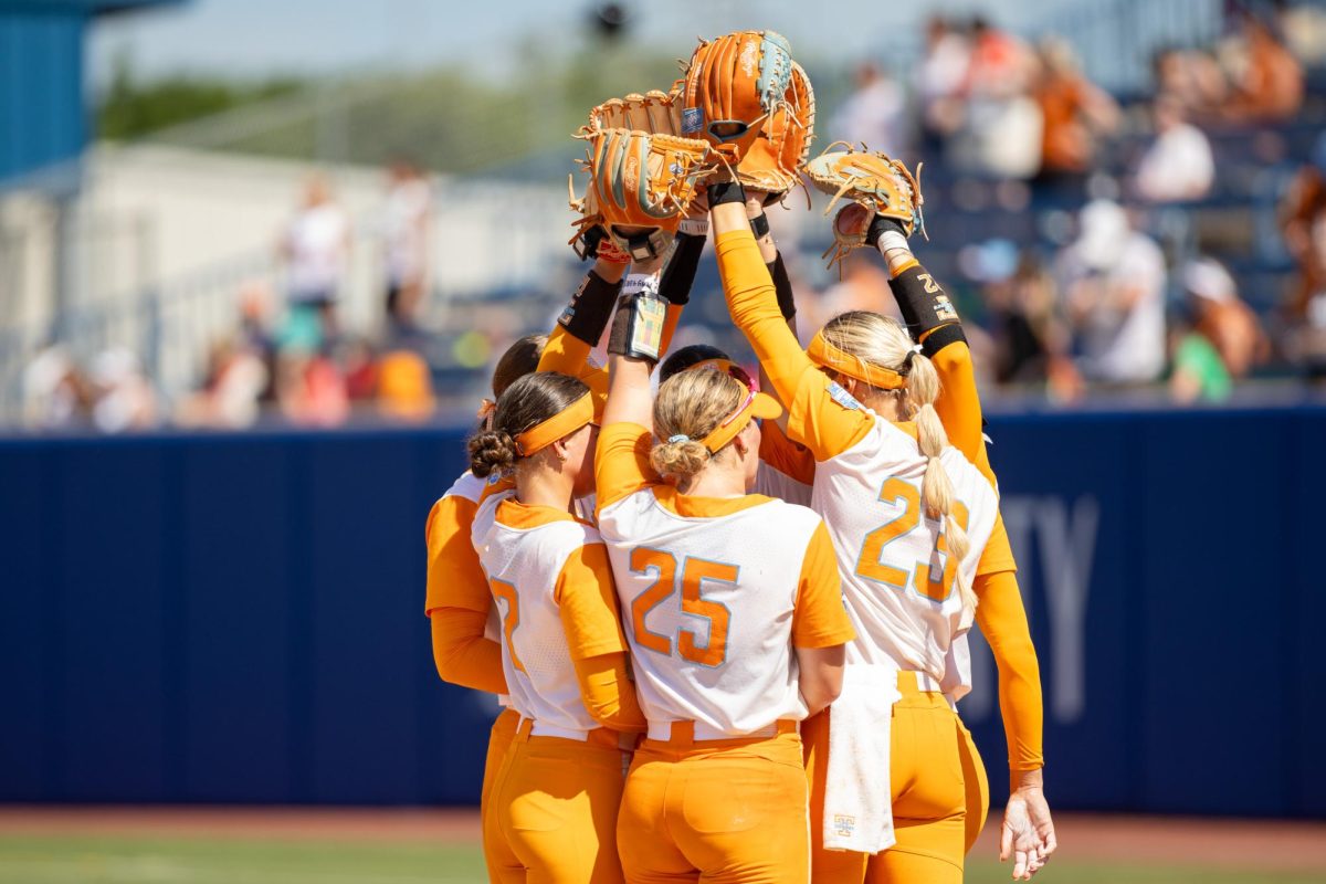Tennessee softball huddles during a game against Texas in the Women's College World Series at Devon Park. Monday, June 1, 2026.