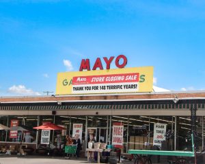 Mayo Garden Center storefront featuring closing sale sign.